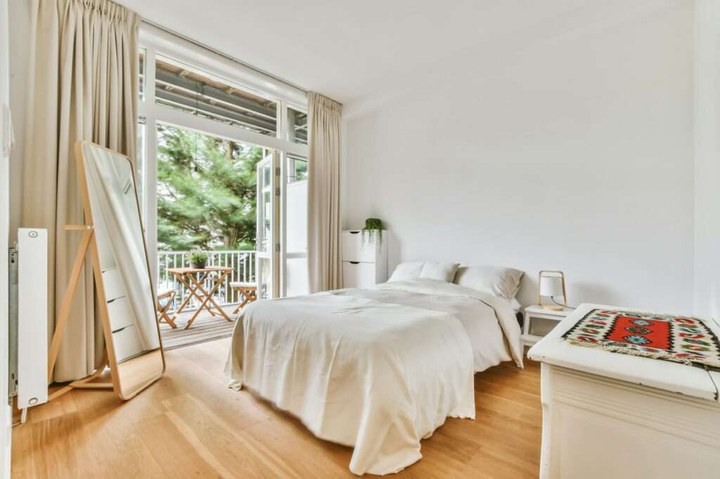 Beautiful image of a fully decorated double bedroom in a white interior design house; design ideas