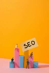 Diagram, paper with SEO letters and people on yellow background, space for text