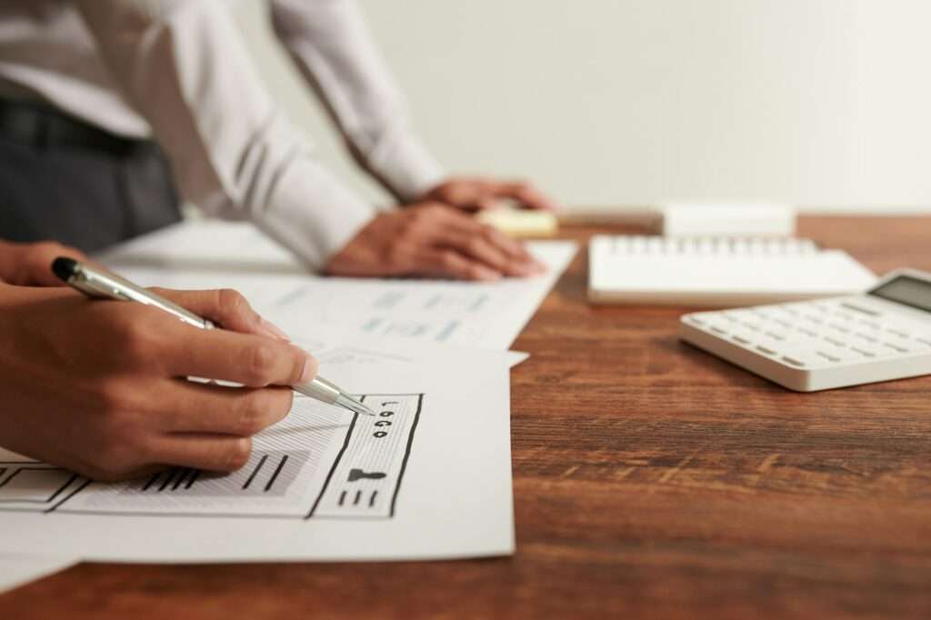 UI Designer Drawing Wireframe of Website