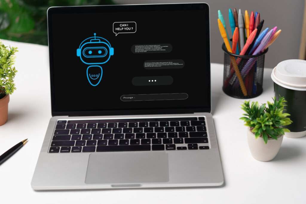 Webdesign Hannover - Offener Laptop mit einer Chatbot-Oberfläche und der Dialogbox „Kann ich Ihnen helfen?“ fragt: „Wie implementiere ich einen Chatbot?“ Das Setup umfasst Pflanzen, einen Stifthalter mit bunten Stiften, eine Kaffeetasse und eine kleine Topfpflanze auf dem Schreibtisch. Local SEO Agentur Hannover.